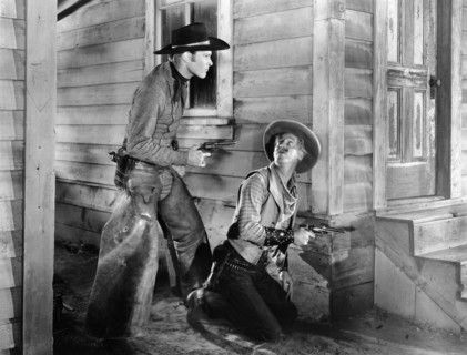 Leif Erickson, Irving Bacon, on-set of the western film, "Drift Fence", Paramount Pictures, 1936
