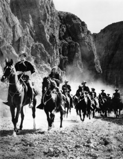 William Holden (foreground, left), on-set of the western film, "Escape From Fort Bravo", MGM, 1953
