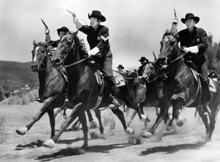 Group of Texas State Police "Bluebellies" on horseback, on-set of the western film, "The Fabulous