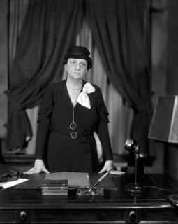 Frances Perkins, U.S. Secretary of Labor 1933-45, half-length portrait standing at her desk,