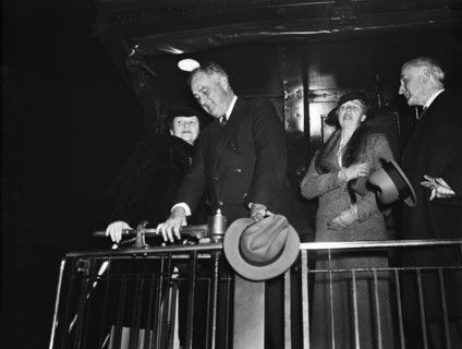 U.S. Secretary of Labor Frances Perkins (left), U.S. President Franklin Roosevelt (2nd left), U.S.