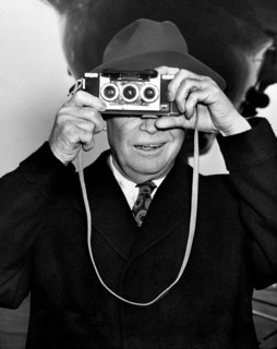 U.S. President Dwight D. Eisenhower photographing his photographers at the airport prior to his