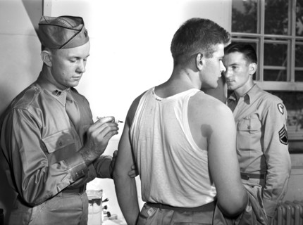 George Camblair getting his injections at reception center, Fort Belvoir, Virginia, USA, Jack
