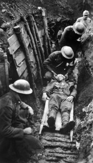 U.S. marine receiving first aid before being sent to hospital in rear of trenches. Toulon Sector,