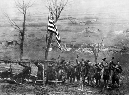 Gun from Battery D, 105th Field Artillery, showing American flag, hoisted after last shot was fired