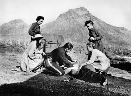 Audie Murphy (on knees, center), on-set of the western film, "The Guns Of Fort Petticoat", Columbia