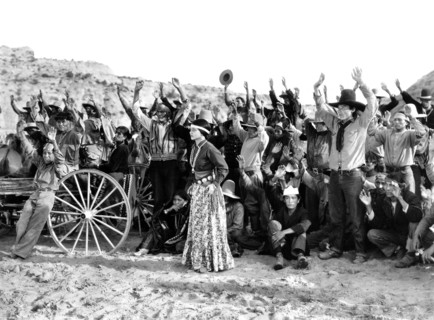 Dorothy Appleby (standing center), on-set of the western film, "King Of The Wild Horses", Columbia