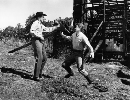 Michael Landon (right), Jack Hogan (left), on-set of the western film, "The Legend Of Tom Dooley",