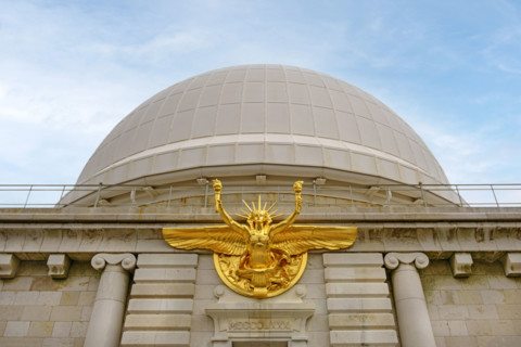 Low angle view of main entrance with bronze statue of Greek God Apollo and dome, Nice Observatory,