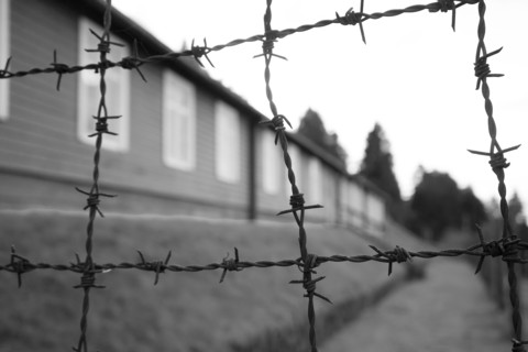 Barbed wire and building exterior, Natzweiler-Struthof Nazi concentration camp, Natzwiller,