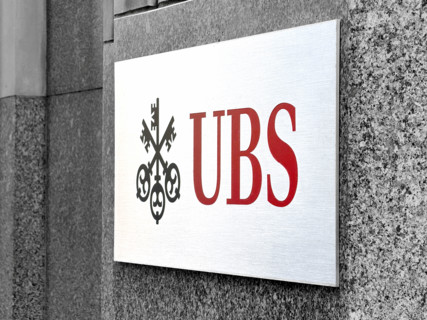 UBS Group AB, close-up of office building exterior with company logo and sign, New York City, New