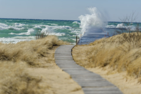Waves crashing on dock, Lake Michigan, Frankfort, Michigan, USA