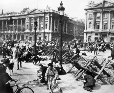 Crowds of Parisians celebrating the entry of Allied troops scattering for cover as sniper fires