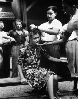 French civilians shaving woman's head as punishment for having personal relations with German