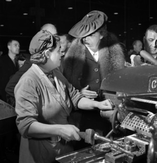 U.S. First Lady Eleanor Roosevelt talking with woman machinist during her goodwill tour of Great