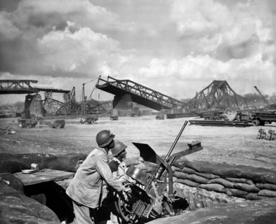 U.S. Privates George Cofield and Howard J. Davis guarding newly-constructed bridge site over Rhine