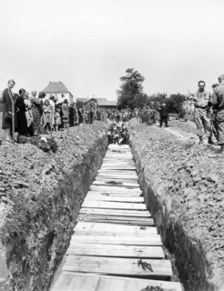 Civilians giving burial to 800 victims of SS killing. which was ordered by the military government