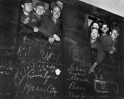 Happy veterans heading for harbor of Le Havre, France, the first to be sent home and discharged