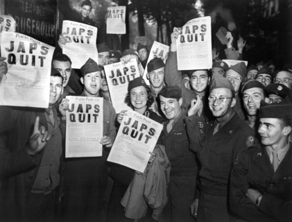 GI's at Rainbow Corner Red Cross Club celebrating after buying special edition of Paris Post