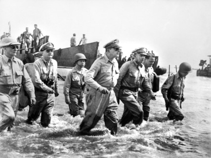 U.S. General Douglas MacArthur wading ashore during initial landings at Leyte Island, Philippine, U