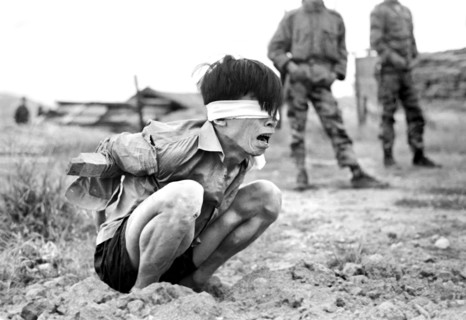 Viet Cong prisoner awaiting interrogation at A-109 Special Forces Detachment, Thuong Duc, South