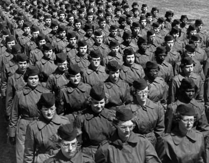Group of female basic trainees marching in company formation at WAC training Center, Fort
