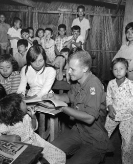 Private First Class, Alan Wondra conducting  class in English at Vietnamese school during civic