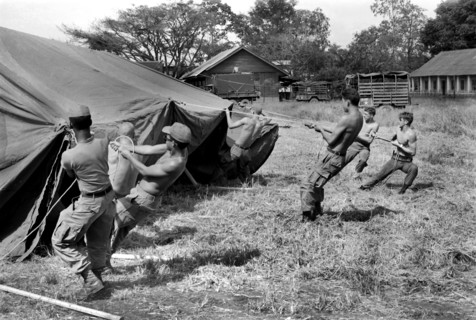 Personnel from U.S. Forward Mobile Staff putting up tent at their new location, Ban Me Thout,