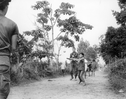 Members of U.S. 3rd Battalion, 187th Infantry, 101st Airborne Division (Airmobile), join children