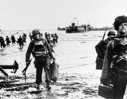 American assault troops, carrying full equipment, moving onto beachhead,  landing craft jam harbor