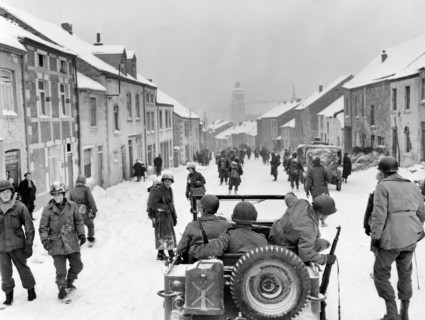 U.S. infantryman of 87th Division entering town after Germans fled, St. Hubert, Belgium, U.S. Army