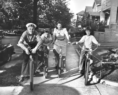 Boys and a girl on bicycles, Detroit, Michigan, USA, Arthur S. Siegel, U.S. Office of War