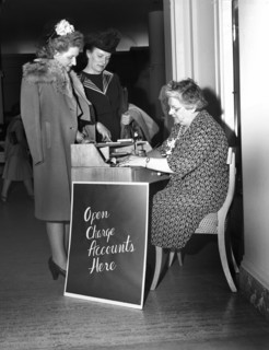Two women opening up charge accounts, Saks Fifth Avenue, Detroit, Michigan, USA, Arthur S. Siegel,
