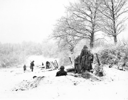 American Infantrymen of the 335th Regiment, 84th Division, taking positions in snow on the front,