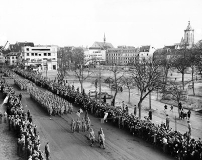 U.S. 28th Infantry Division leading the color guard at Victory Parade after the town's liberation,