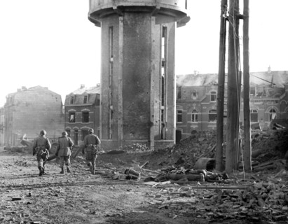 Members of U.S. 101st Airborne Division walking past dead comrades, killed during Christmas Eve