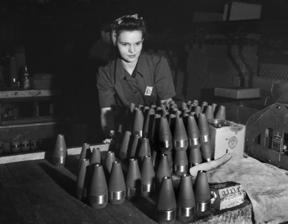 Female factory worker inspecting 60mm shells, Budd Wheel Plant, Detroit, Michigan, USA, Arthur S.