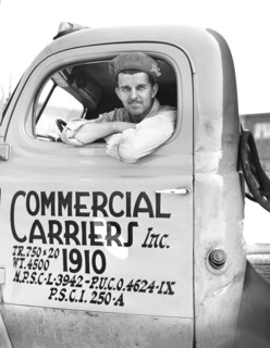 Truck driver, Commercial Carriers, Inc., transports U.S. military vehicles from manufacturing
