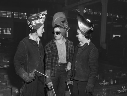 Three female welders in fabricating shop, Bethlehem-Fairfield shipyards, Baltimore, Maryland, USA,