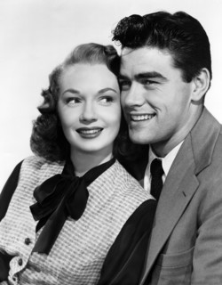 Gloria Henry, Jeff Richards, publicity portrait for the film, "Kill the Umpire", Columbia Pictures,