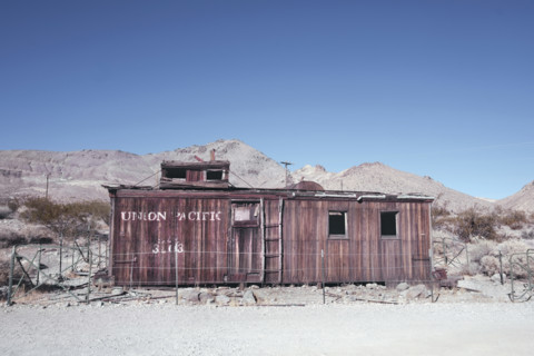 Abandoned Union Pacific train car in desert ghost town, Rhyolite, Nevada, USA