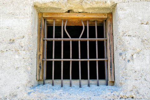 Iron bars on jail window in mining ghost town, Rhyolite, Nevada, USA