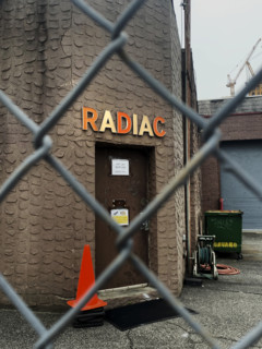 Radiac Research, building exterior viewed through chain link fence, Williamsburg, Brooklyn, New