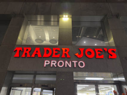 Trader Joe's Pronto, building exterior with company sign at night, New York City, New York, USA,