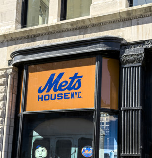 Mets House NYC, pop-up store and activities space, building exterior detail of orange and blue