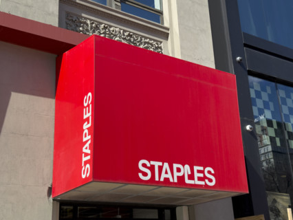 Staples office supplies store, building exterior and store sign above entrance, New York City, New