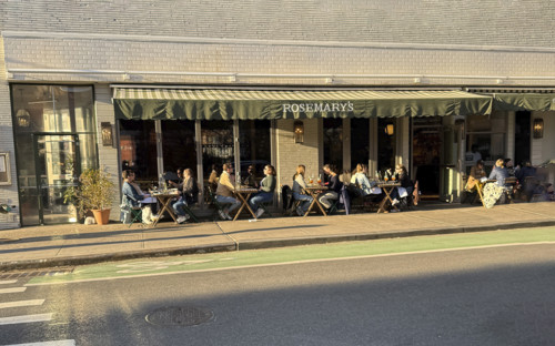 Group of people enjoying outdoor dining on sunny day, Rosemary's Restaurant, New York City, New