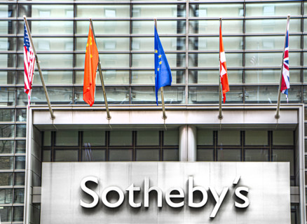 Sotheby's, building exterior detail of flags above company sign, 1334 York Avenue, New York City,