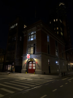 Beaux-Arts style firehouse from 1903 illuminated at night, made famous as the headquarters of the
