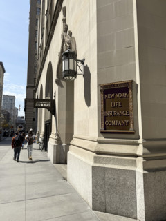 New York Life Insurance Company sign on New York Life building exterior and sidewalk scene, New